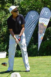 Shiraz Alibhai playing golf at the golf tournament.