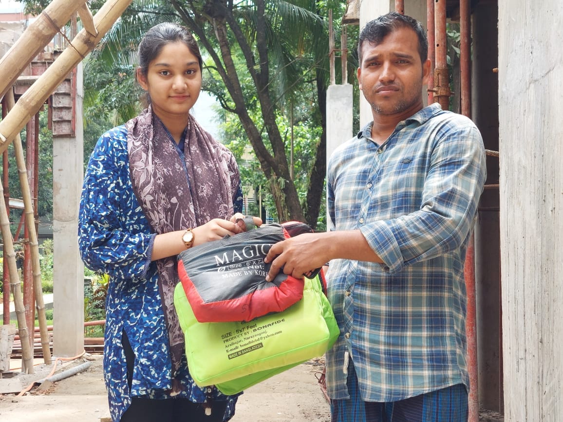 Adiba supporting people from her community through her non-profit, the Esho Pashe Darai Foundation
