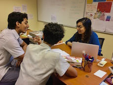 Haifa Badi-Uz-Zaman works with students at the Academy