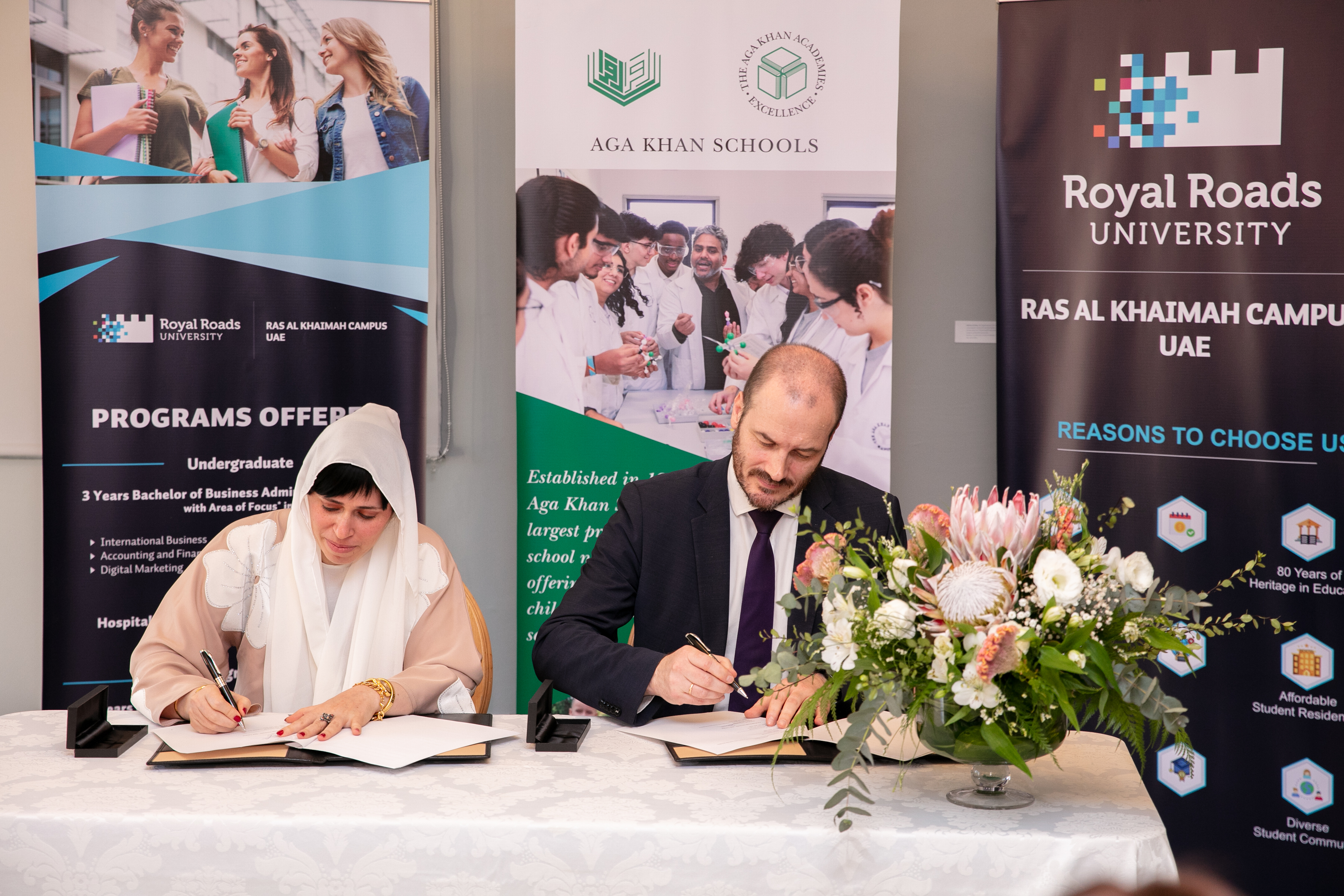 Dr Alaa Mohamad, Vice President – Corporate and Government Relations for Royal Roads University – Ras Al Khaimah Campus and Benoit Destouches, Finance Director of the Aga Khan Schools signing the Memorandum of Understanding.