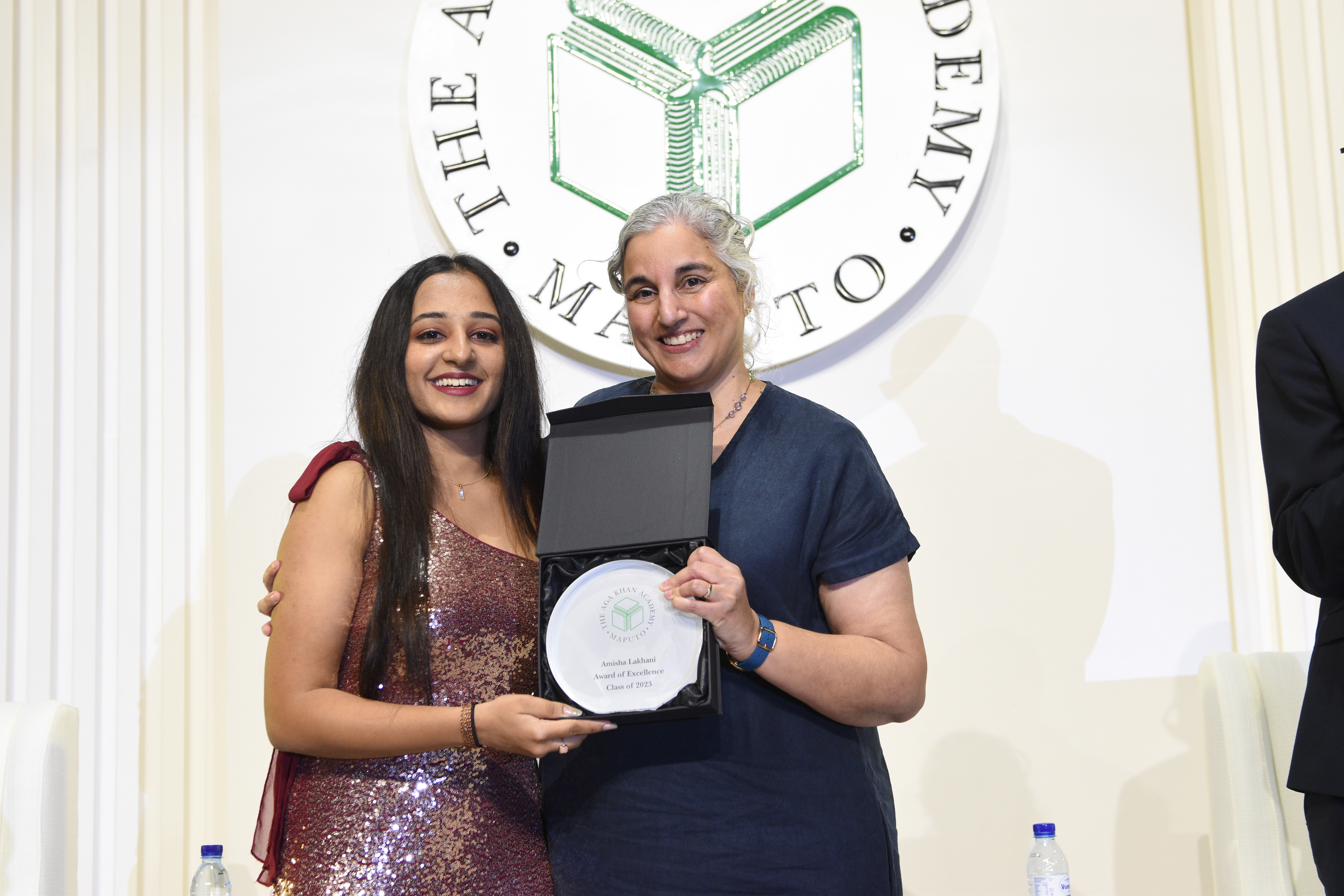 Amisha Lakhani, left, receiving the Award of Excellence from Head of Academy Andrea Spinner.