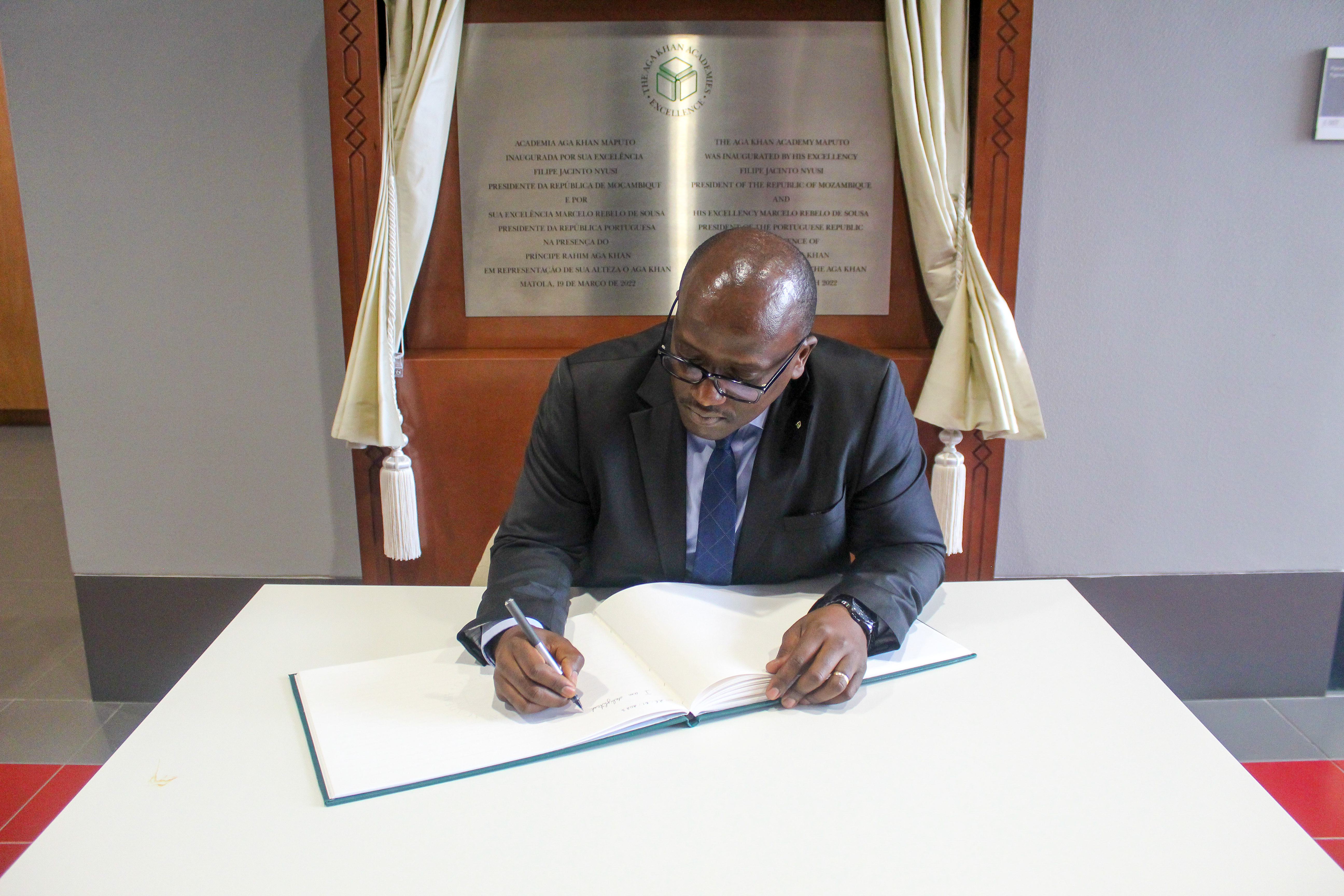 H.E. Mr Nikobisanzwe signing the Academy's guestbook