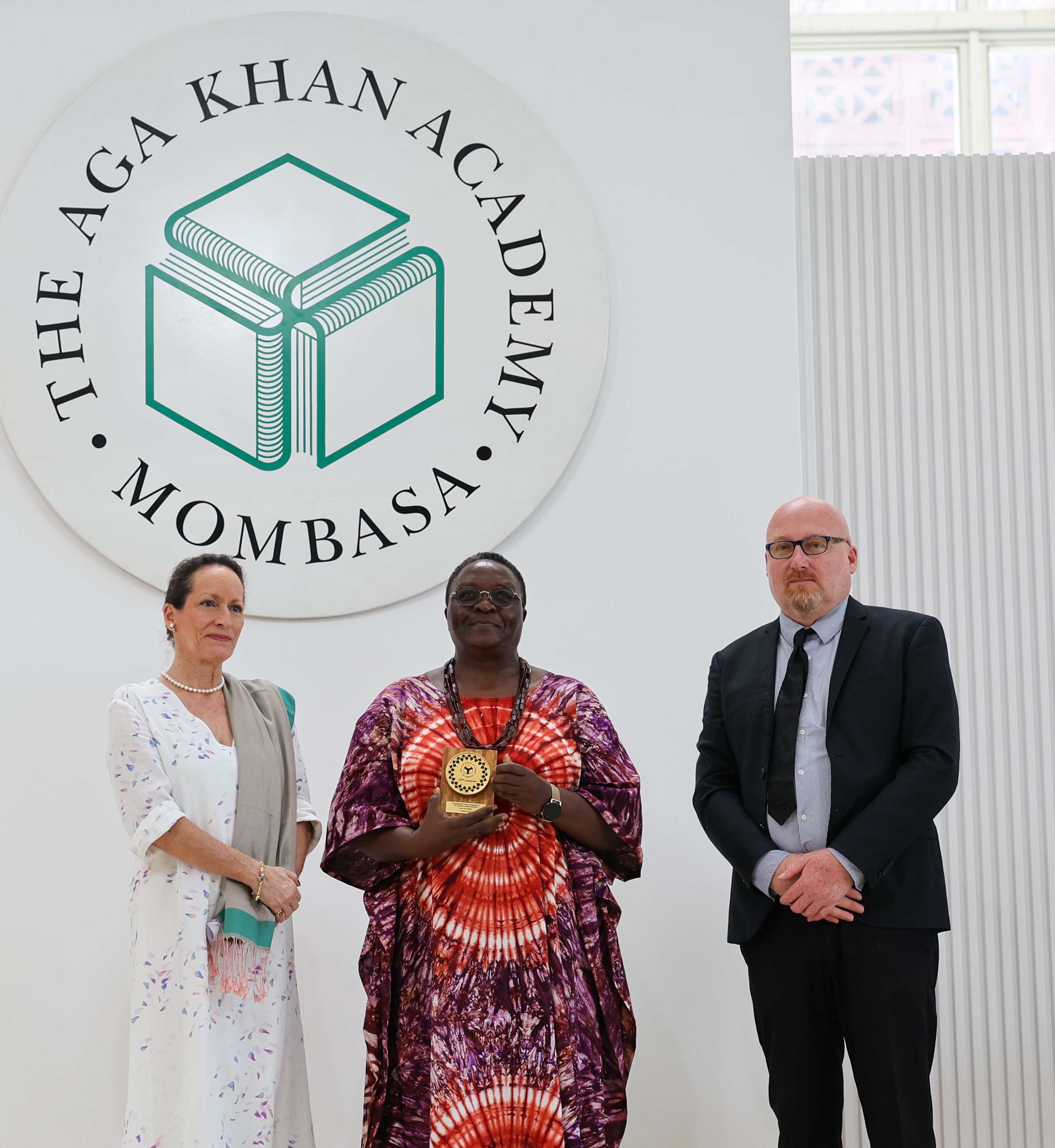 Princess Zahra Aga Khan and Head of Academy Colin Webster with a long-serving staff member