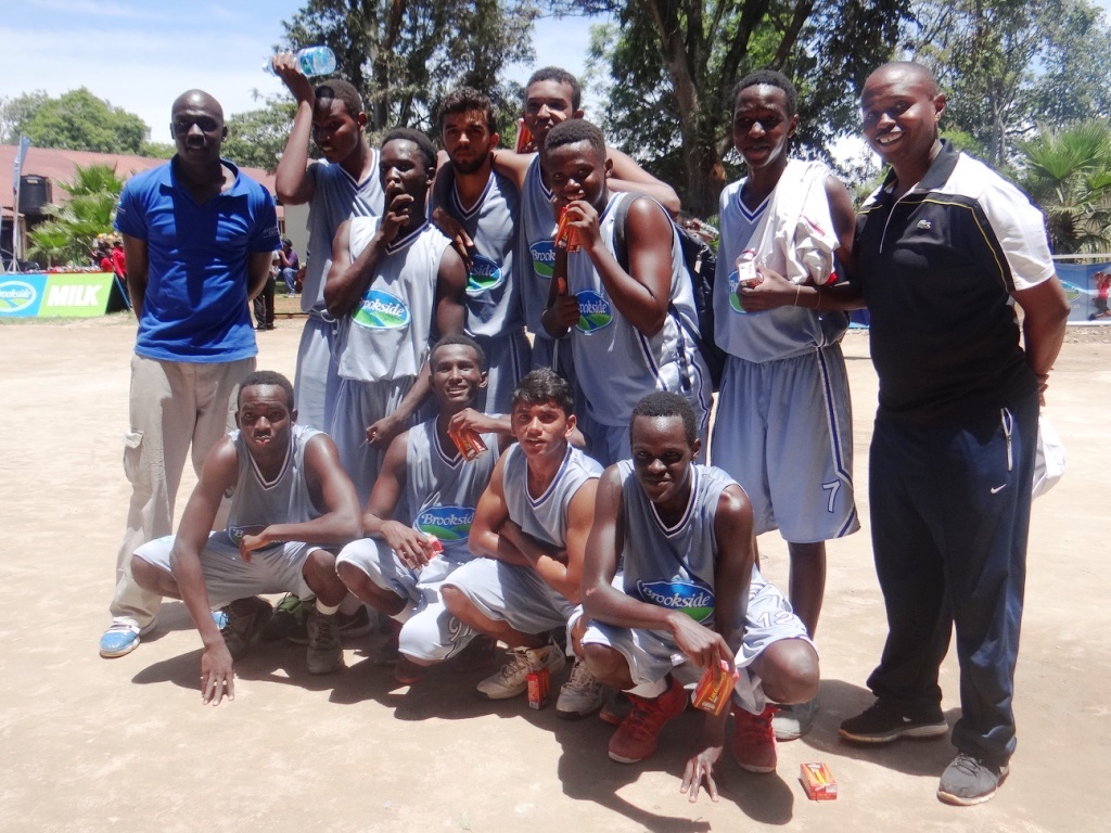Coach Jimnah Kimani (far right) with the AKA Mombasa Open Boys' Basketball team