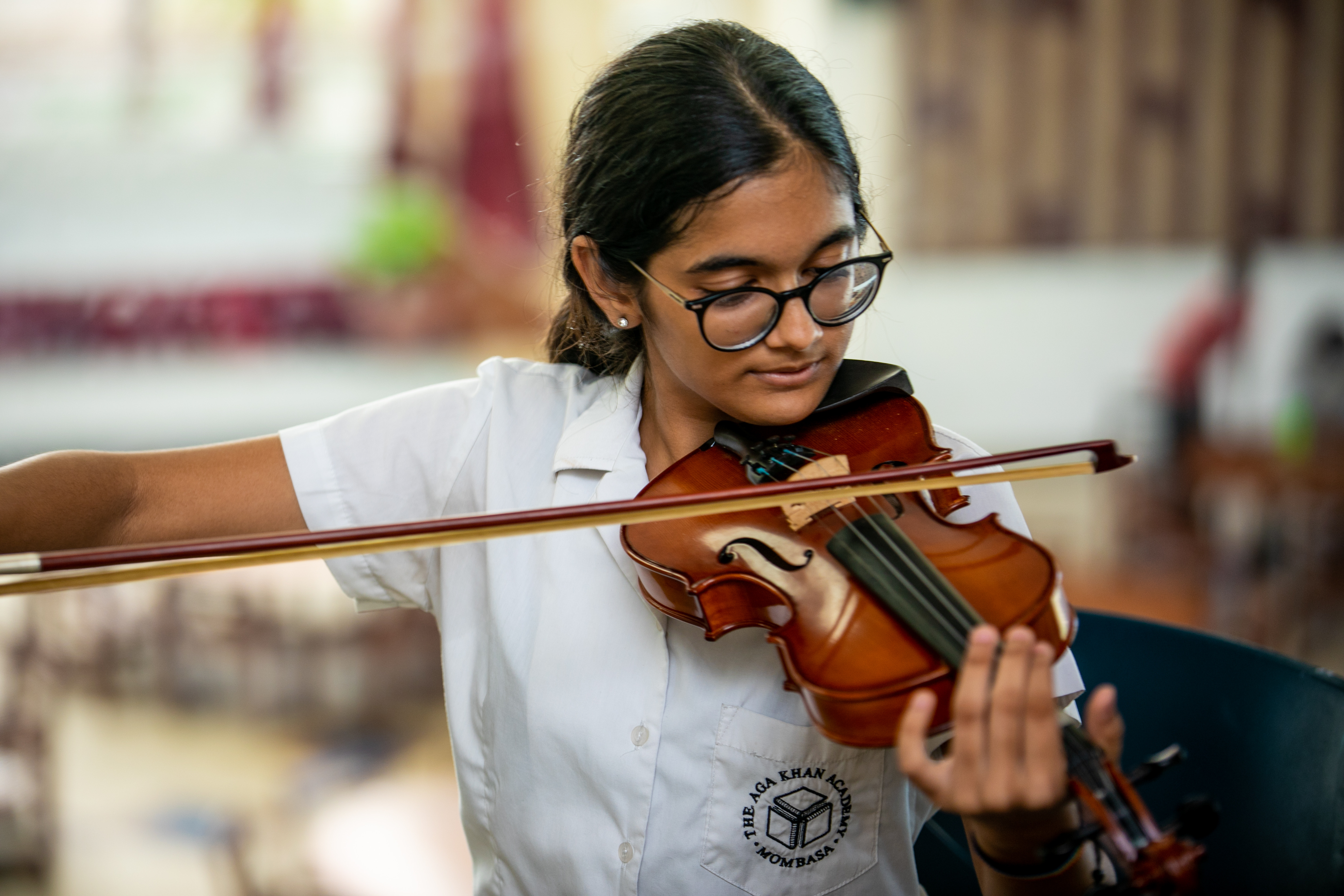 Student playing musical instrument