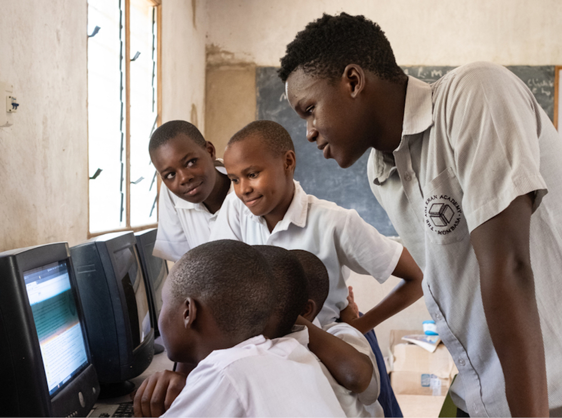 Raphael Mwachiti teaching kids computer skills
