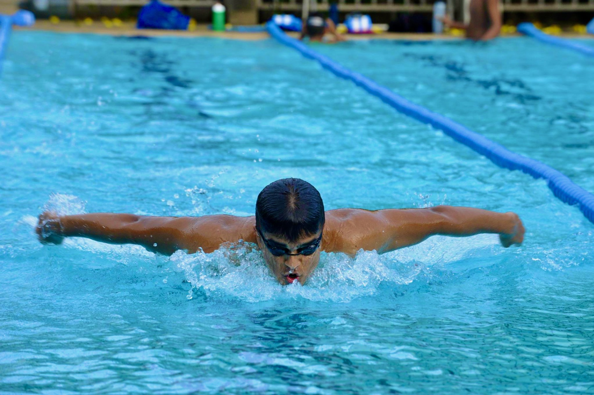 Student swimming butterfly