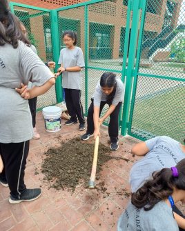 Grade 6 and 7 students serves self-grown fresh vegetables to the support staff 