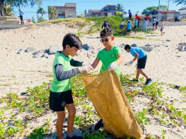 Aga Khan Academy Maputo students doing a beach clean up