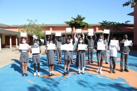 Grade 5 students with their certificates